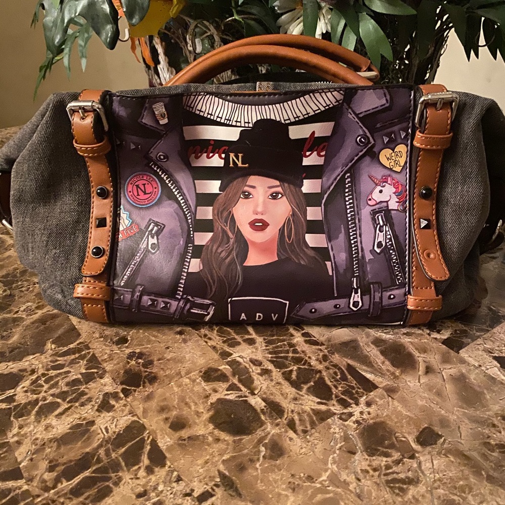 This is definitely a eye catching denim purse.